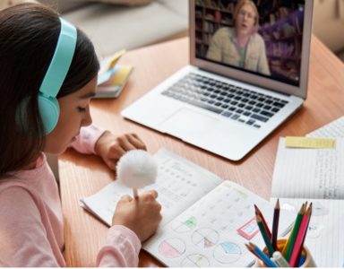 Young girl learning through online tutoring